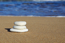 Photograph of three stones balanced